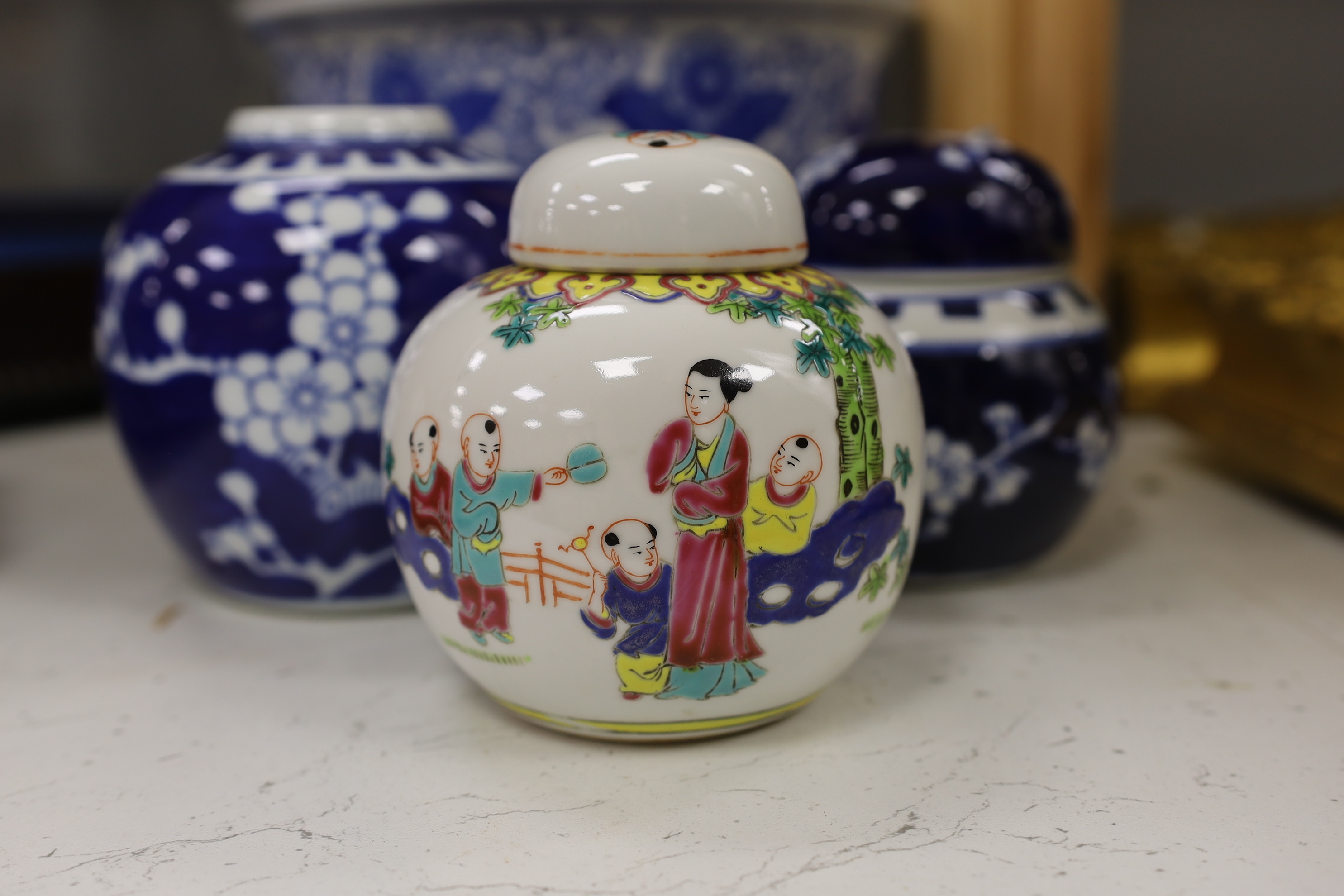 A Chinese famille noire vase and cover, three ginger jars and a jardiniere, largest 33cm